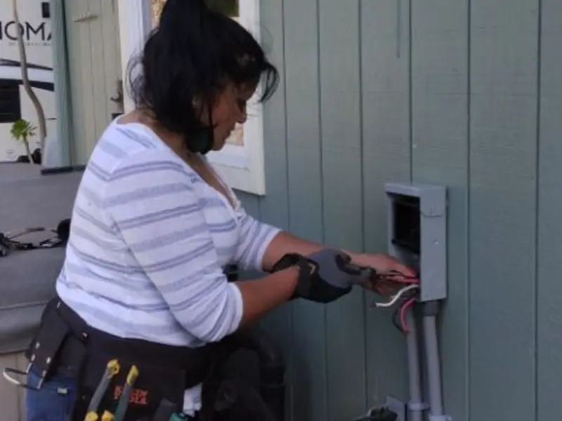 Licensed electrician wiring an exterior subpanel in Vilonia